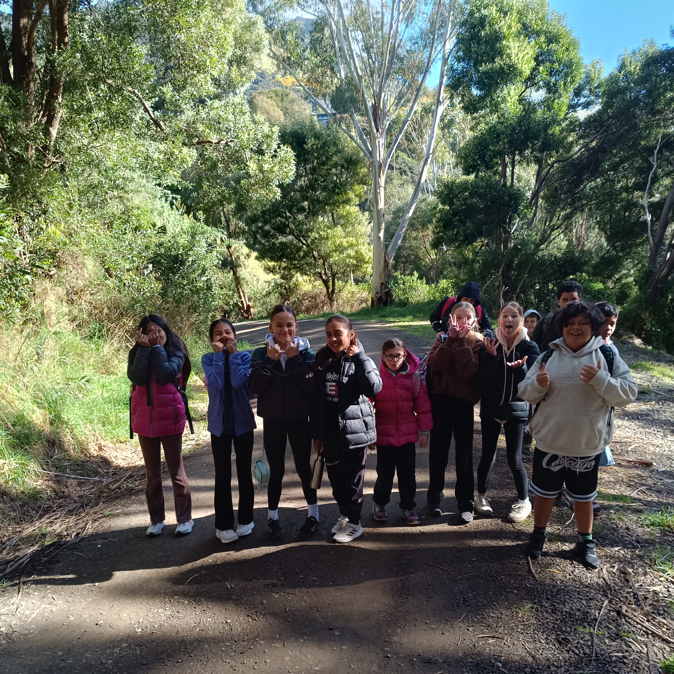 A group of children walking in the bush